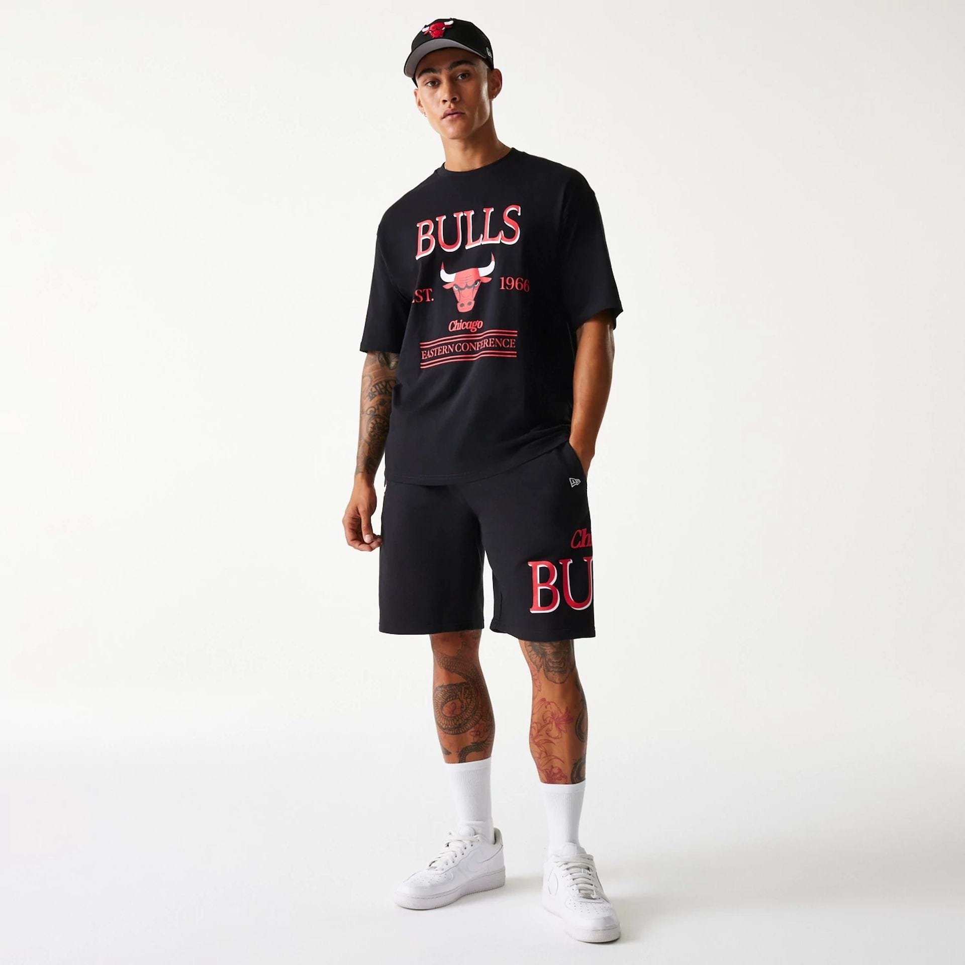 The Male model is wearing Chicago Bulls NBA Team Graphic Black Shorts 6