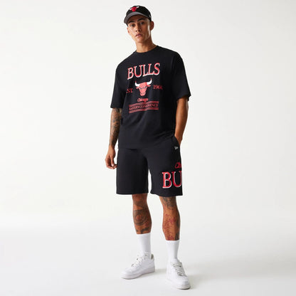 The Male model is wearing Chicago Bulls NBA Team Graphic Black Shorts 6