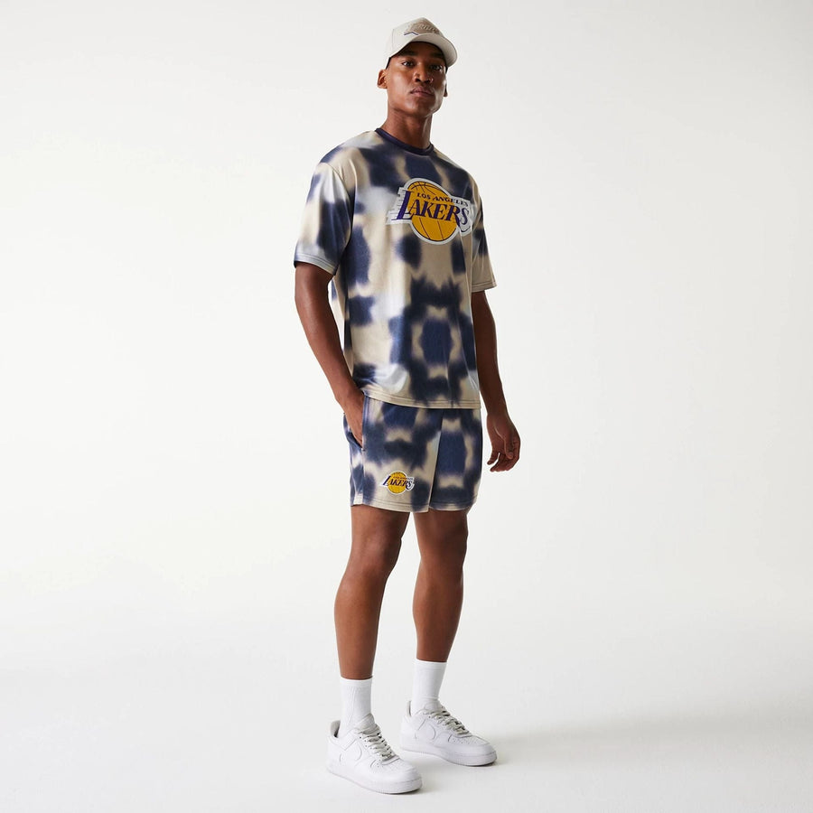 The Male model is wearing LA Lakers NBA All Over Print Cream Shorts 8