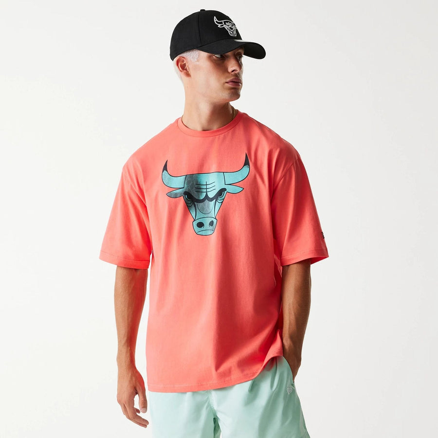 The Male model is wearing Chicago Bulls NBA All Over Print Infill Pink Oversized T-Shirt 1