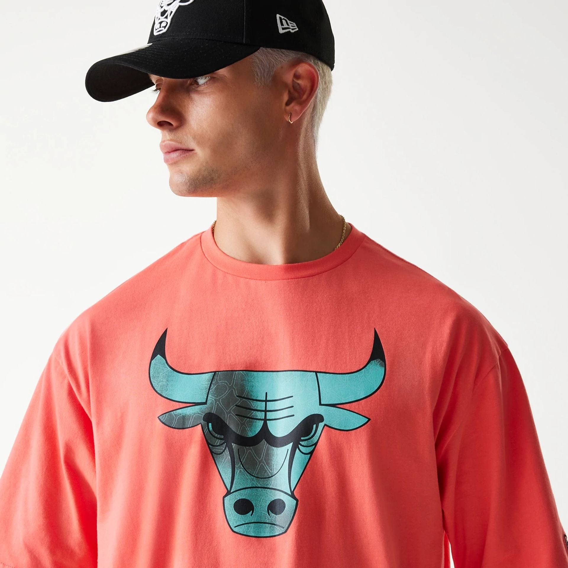 The Male model is wearing Chicago Bulls NBA All Over Print Infill Pink Oversized T-Shirt 4