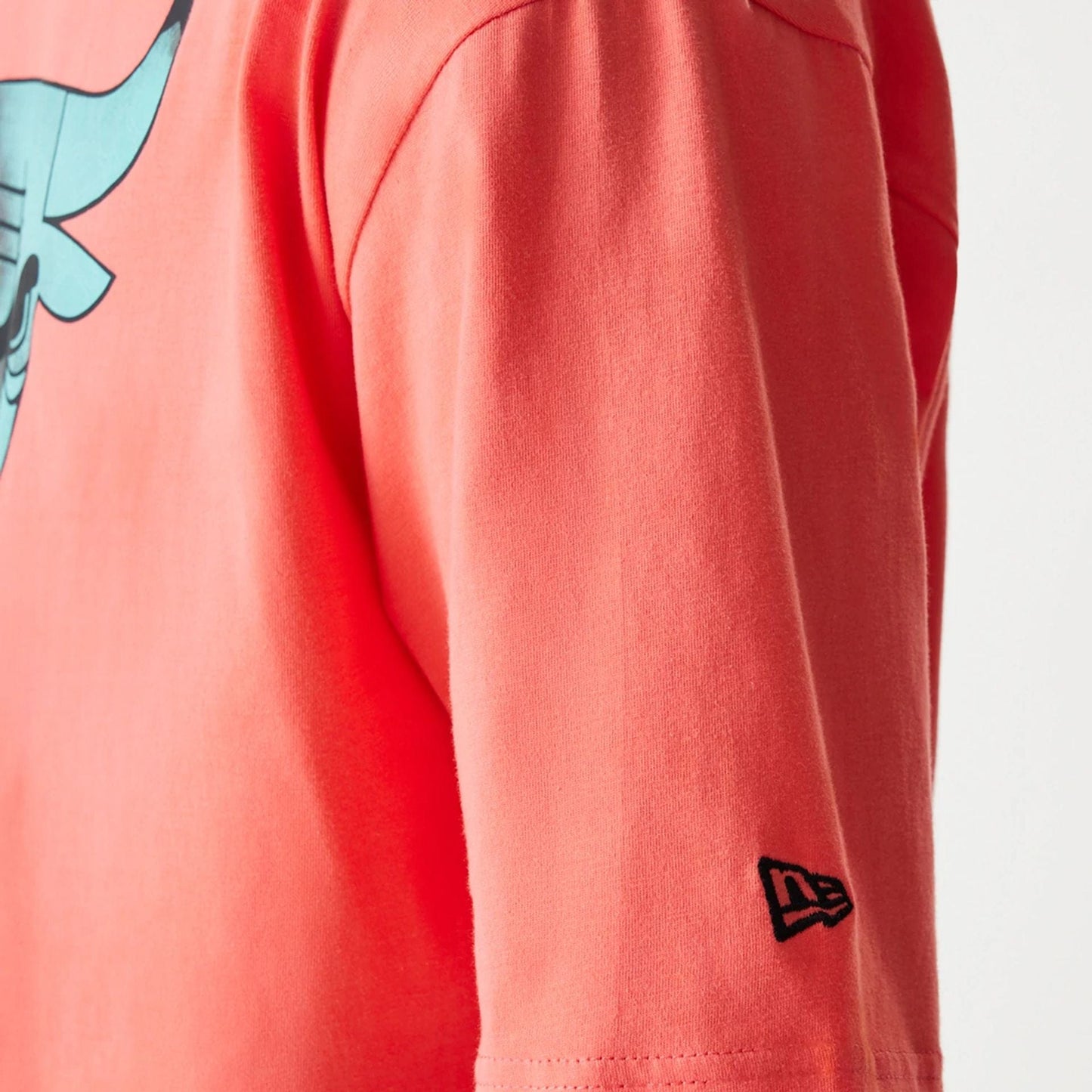 The Male model is wearing Chicago Bulls NBA All Over Print Infill Pink Oversized T-Shirt 5