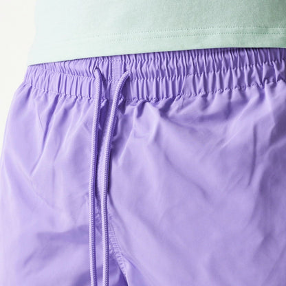 The Male model is wearing New Era Purple Swim Shorts 7