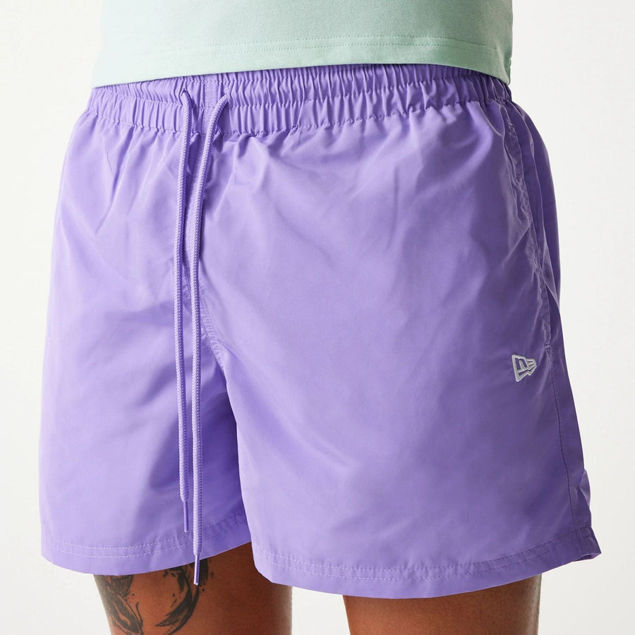 The Male model is wearing New Era Purple Swim Shorts 5