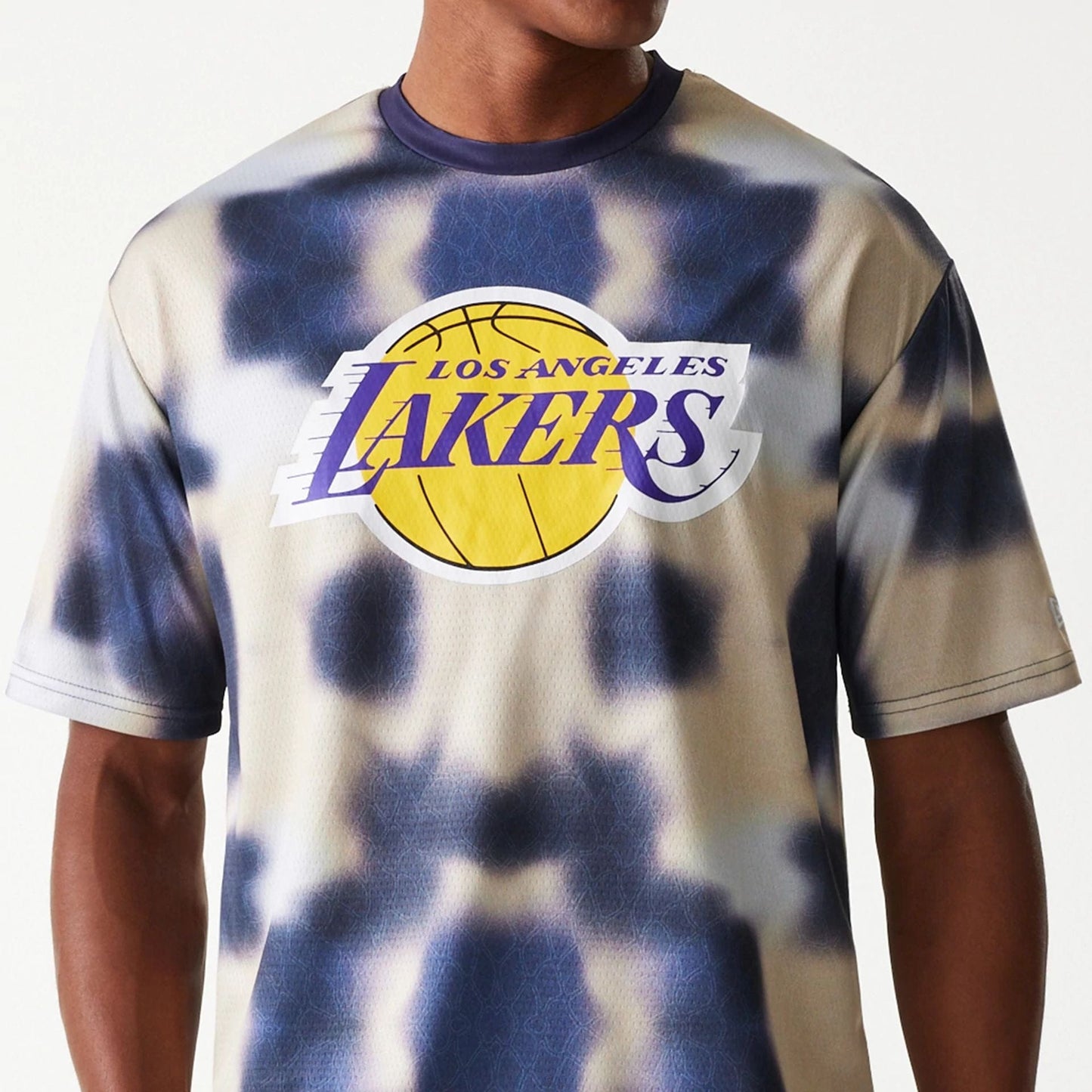 The Male model is wearing LA Lakers NBA All Over Print Cream Oversized T-Shirt 3
