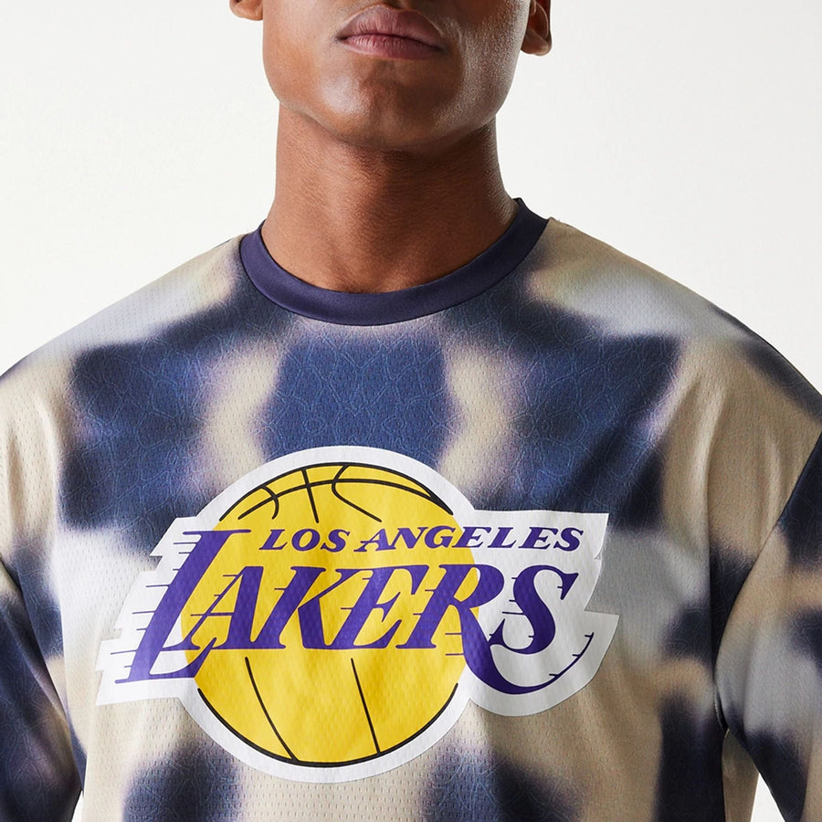 The Male model is wearing LA Lakers NBA All Over Print Cream Oversized T-Shirt 6