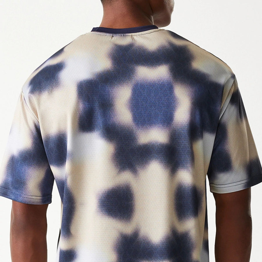 The Male model is wearing LA Lakers NBA All Over Print Cream Oversized T-Shirt 7