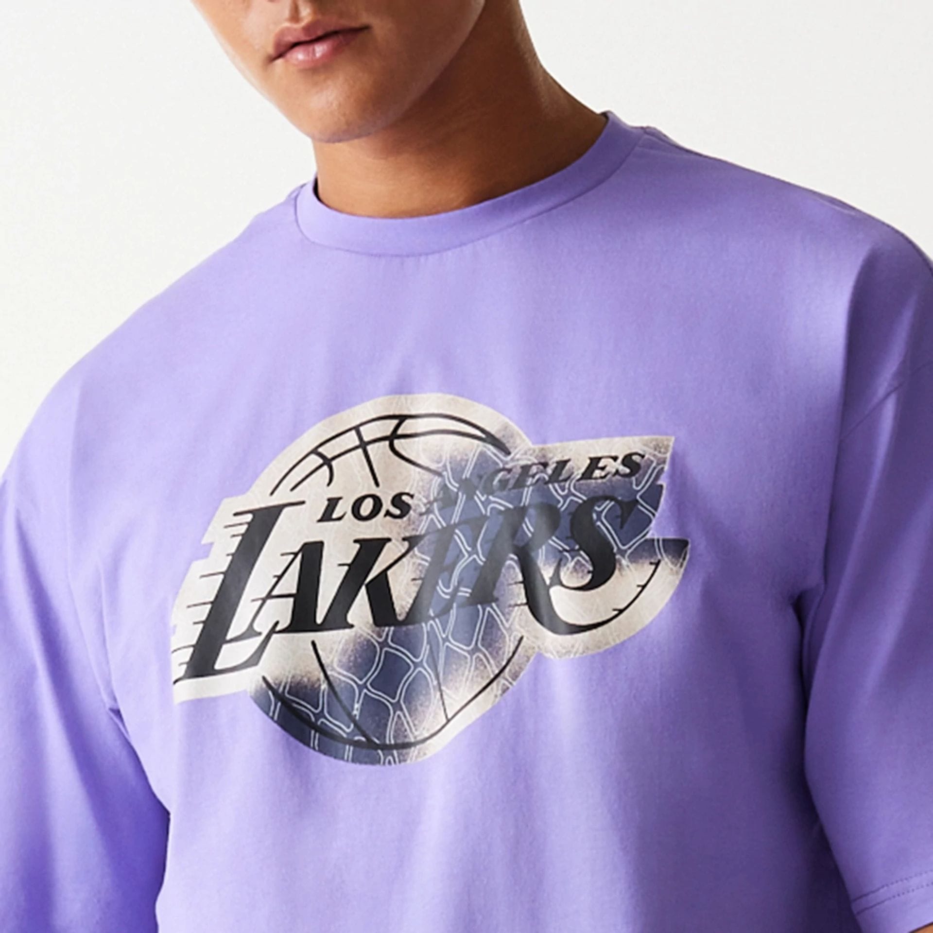 The Male model is wearing LA Lakers NBA All Over Print Infill Purple Oversized T-Shirt 7