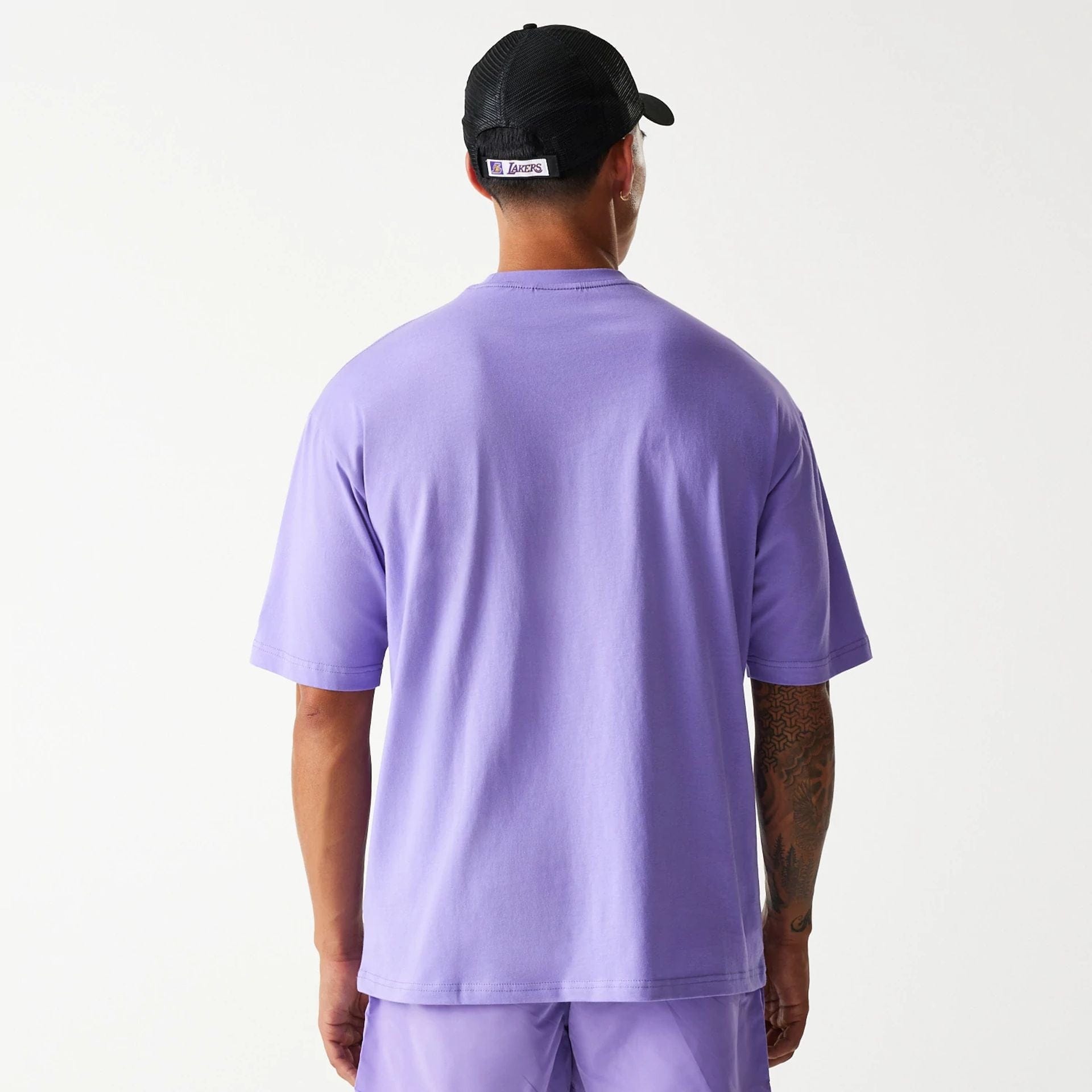 The Male model is wearing LA Lakers NBA All Over Print Infill Purple Oversized T-Shirt 2