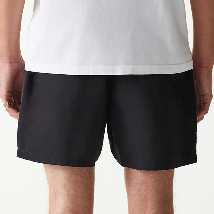 The Male model is wearing New Era Black Swim Shorts 6