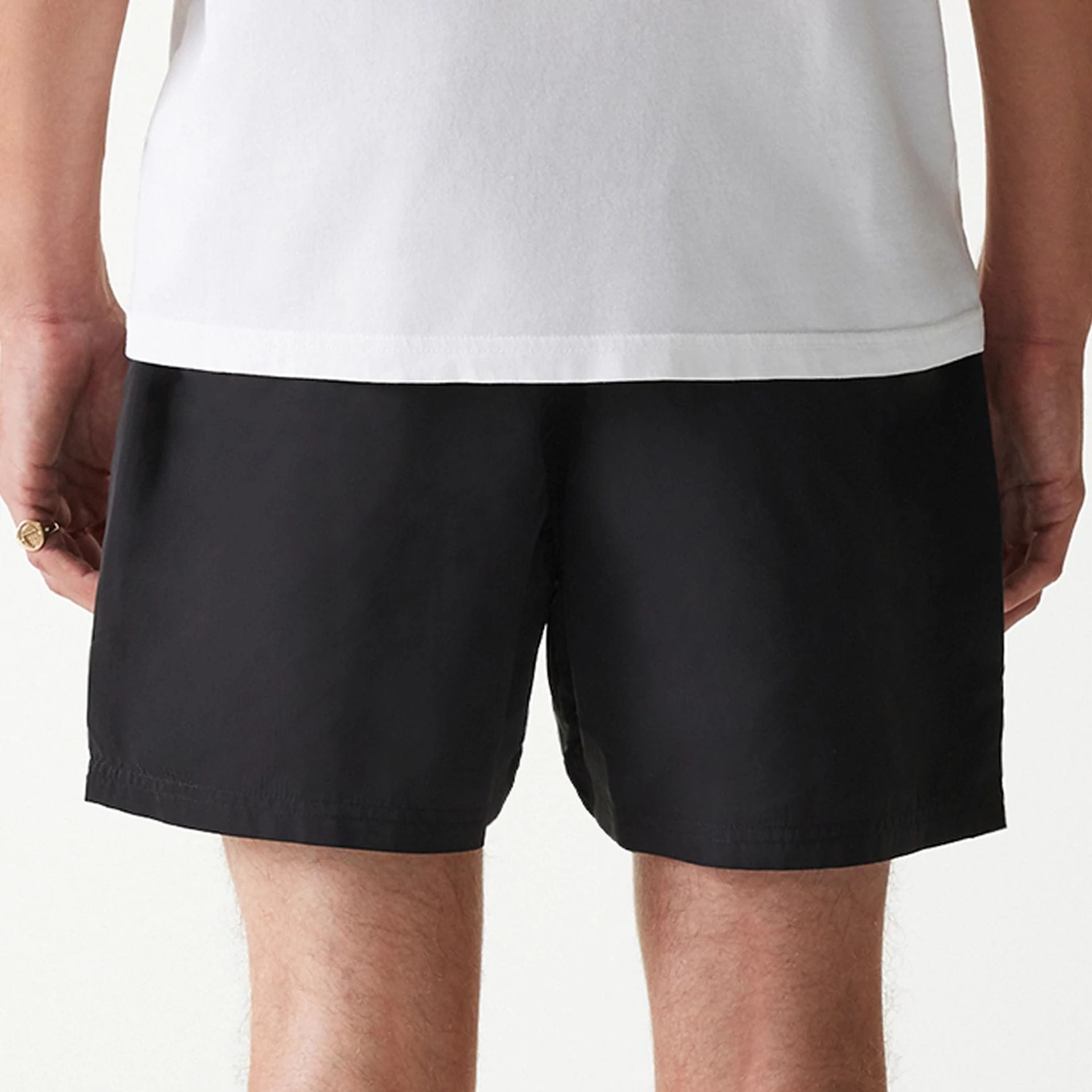 The Male model is wearing New Era Black Swim Shorts 6