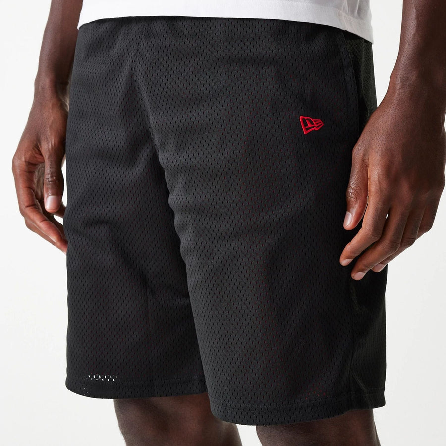 The Male model is wearing New Era Black Mesh Shorts 6