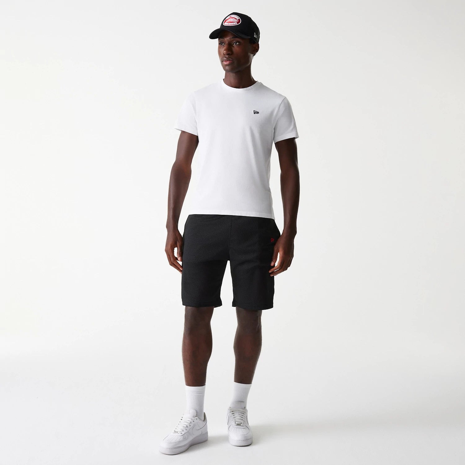 The Male model is wearing New Era Black Mesh Shorts 8