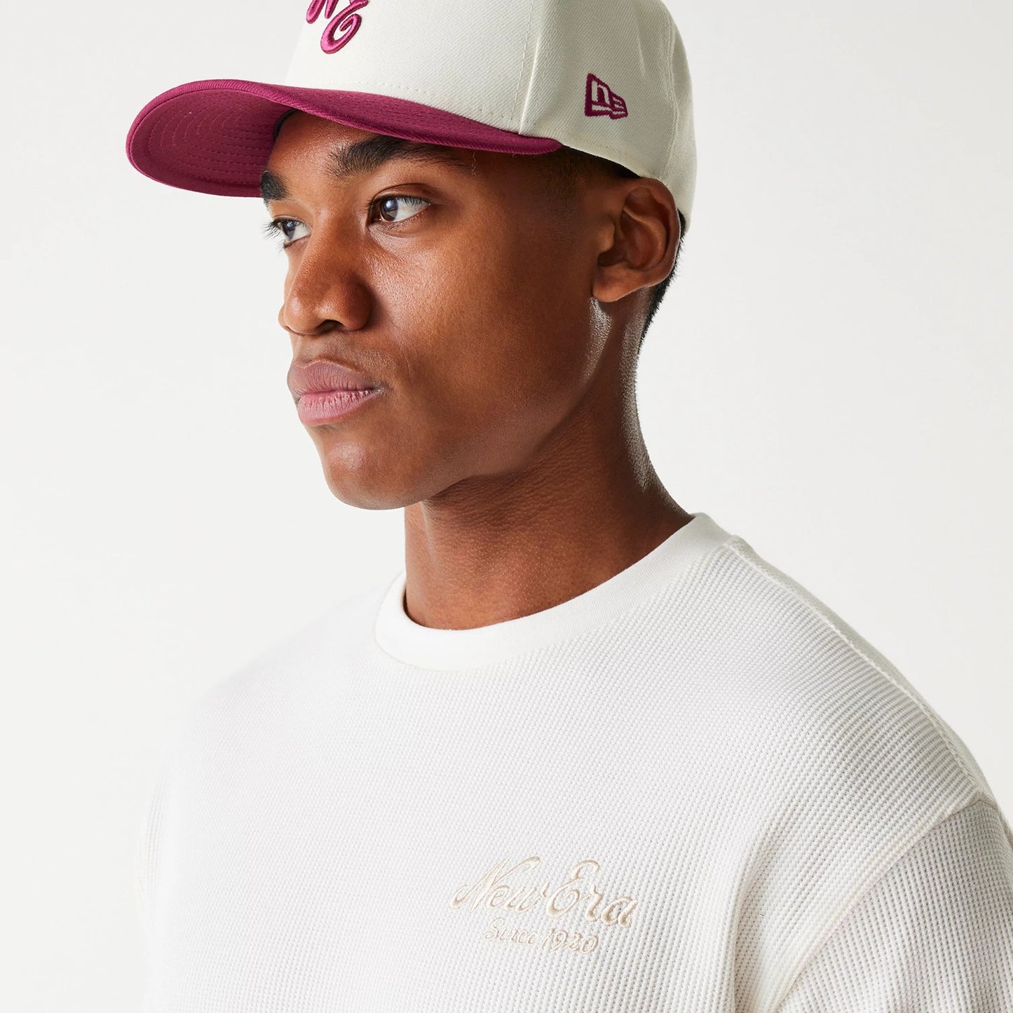 The Male model is wearing New Era Waffle Open White Oversized T-Shirt 5