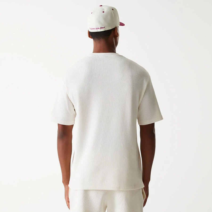 The Male model is wearing New Era Waffle Open White Oversized T-Shirt 2
