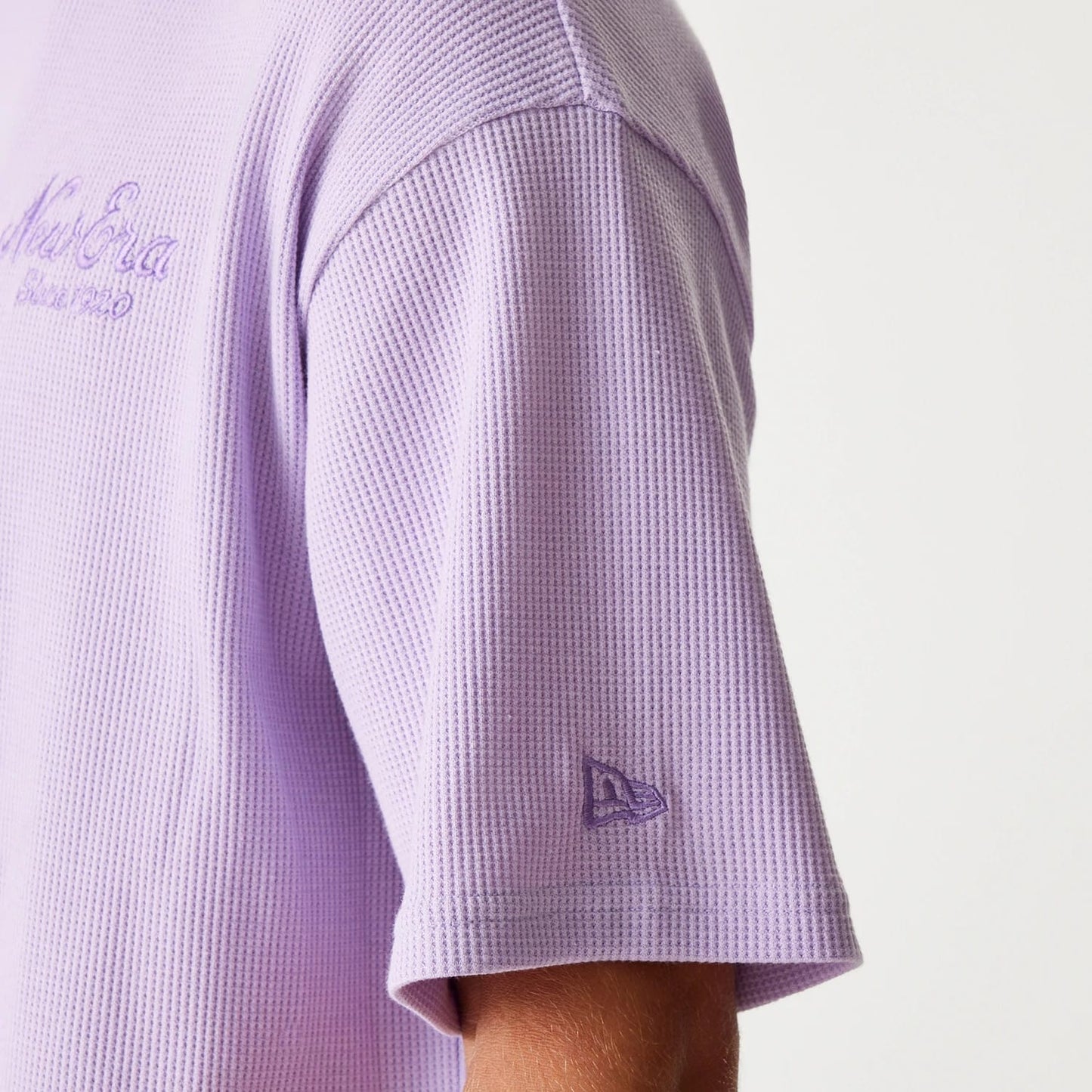 The Male model is wearing New Era Waffle Pastel Purple Oversized T-Shirt 7
