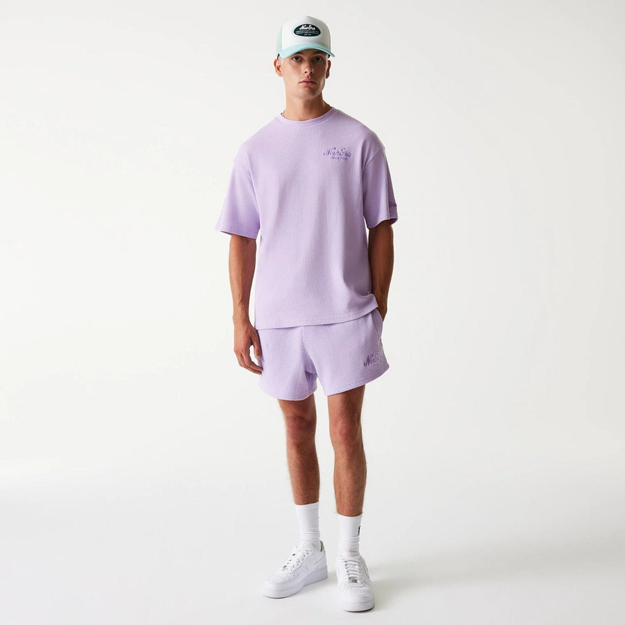 The Male model is wearing New Era Waffle Pastel Purple Oversized T-Shirt 8