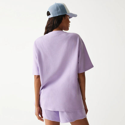 The Male model is wearing New Era Waffle Pastel Purple Oversized T-Shirt 2
