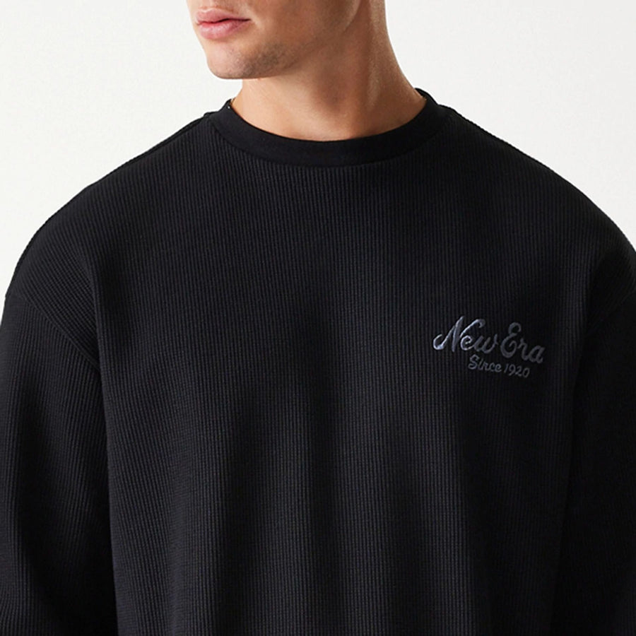 The Male model is wearing New Era Waffle Black Oversized Crew Neck Sweater 5