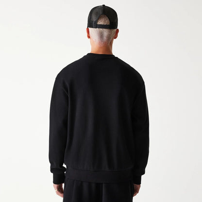 The Male model is wearing New Era Waffle Black Oversized Crew Neck Sweater 2
