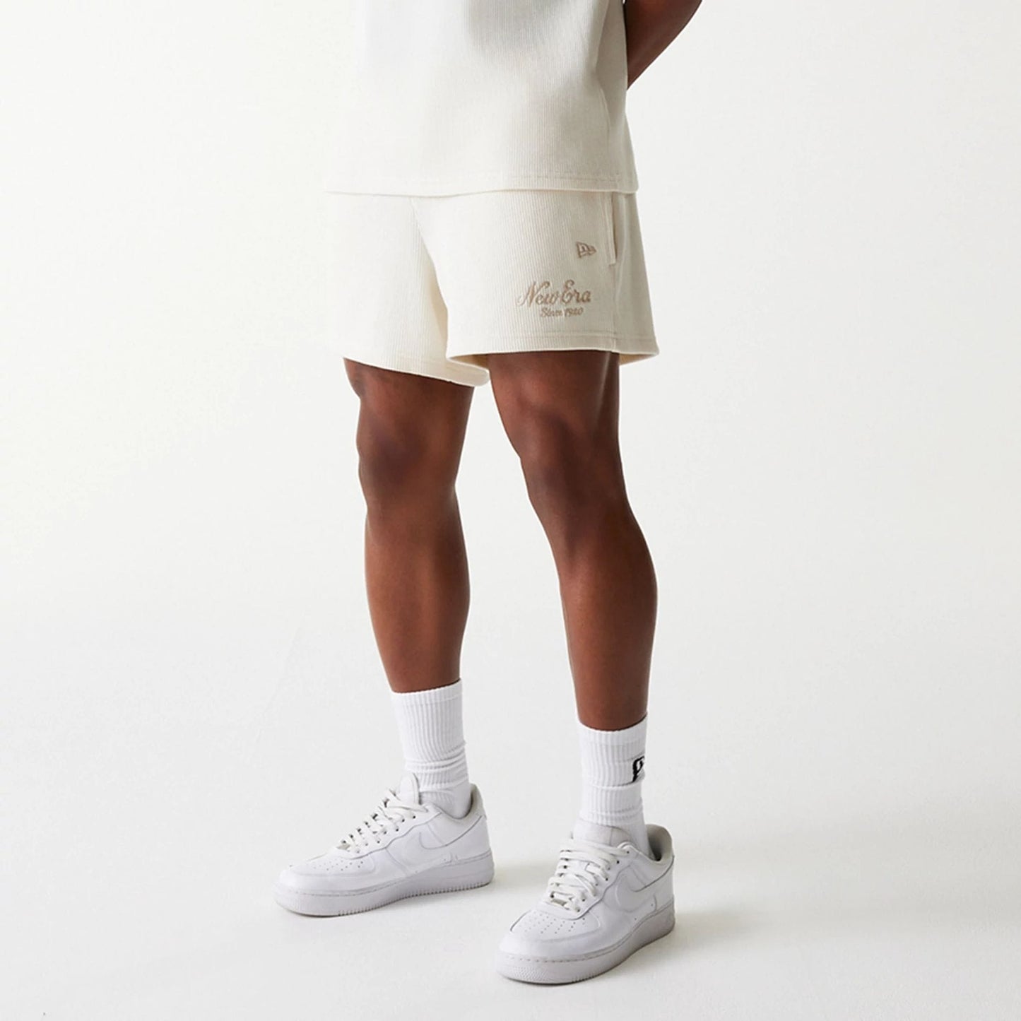 The Male model is wearing New Era Waffle Open White Shorts 5