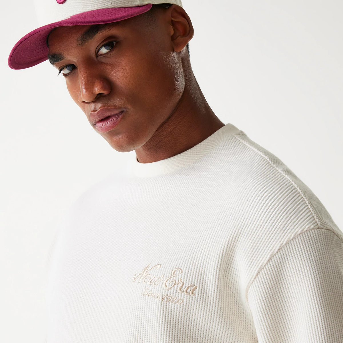 The Male model is wearing New Era Waffle Open White Oversized Crew Neck Sweater 6