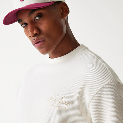 The Male model is wearing New Era Waffle Open White Oversized Crew Neck Sweater 6