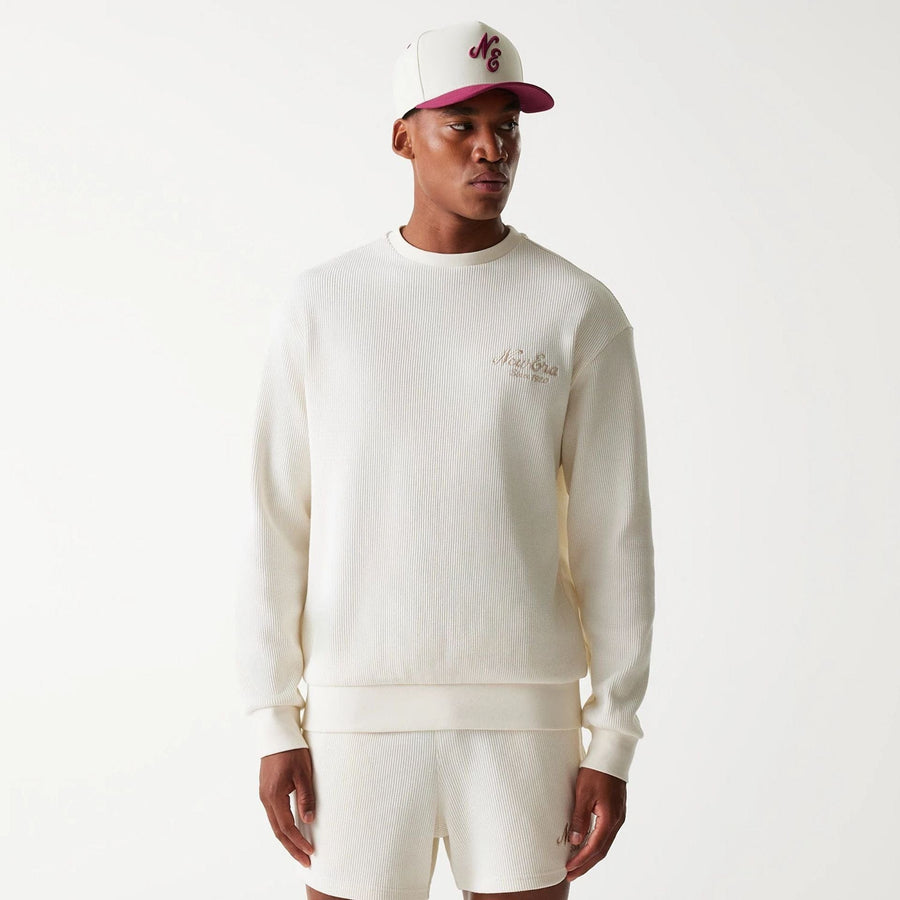 The Male model is wearing New Era Waffle Open White Oversized Crew Neck Sweater 1