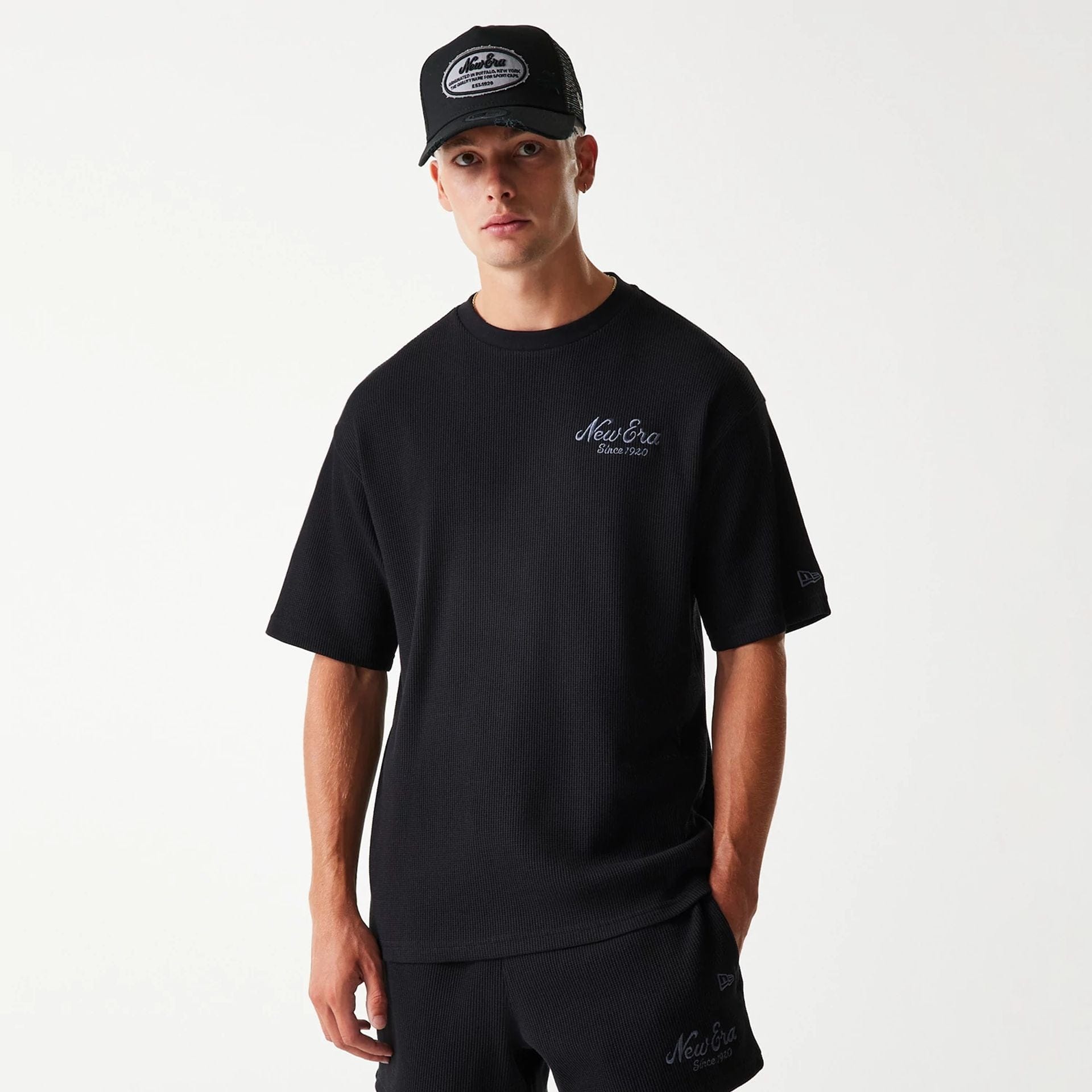 The Male model is wearing New Era Waffle Black Oversized T-Shirt 3