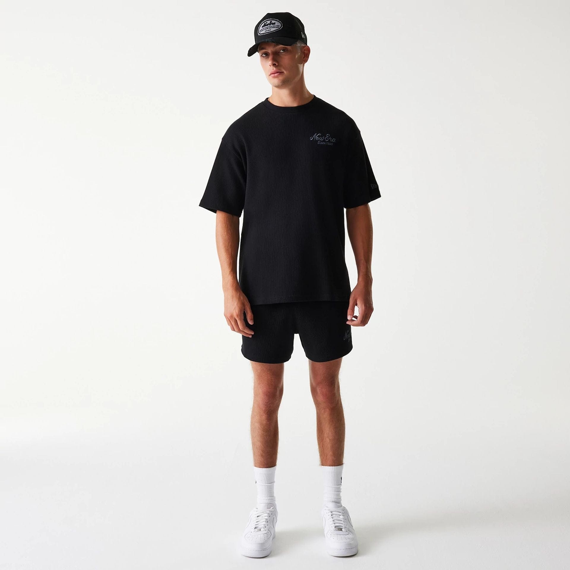 The Male model is wearing New Era Waffle Black Oversized T-Shirt 7