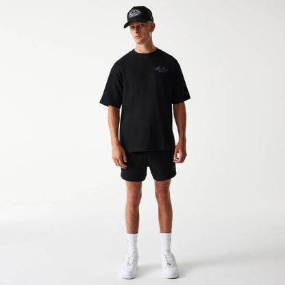 The Male model is wearing New Era Waffle Black Oversized T-Shirt 7