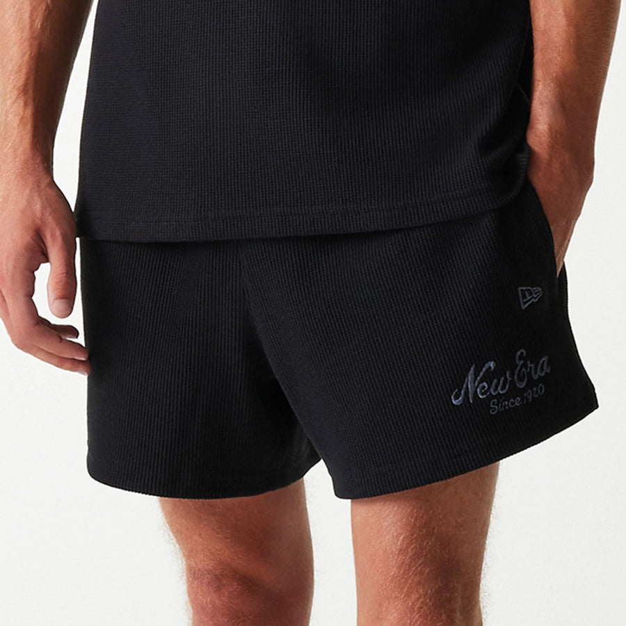 The Male model is wearing New Era Waffle Black Shorts 4
