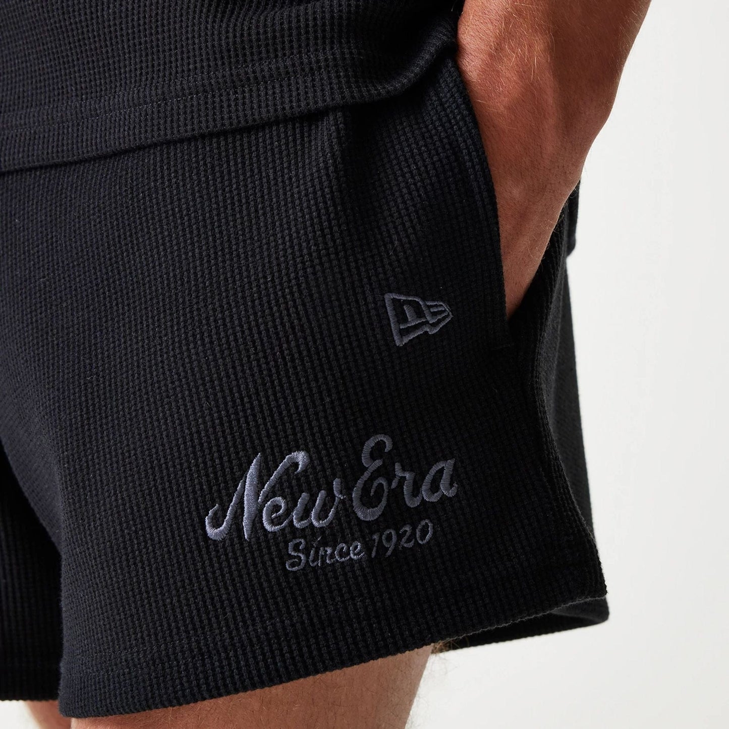 The Male model is wearing New Era Waffle Black Shorts 6
