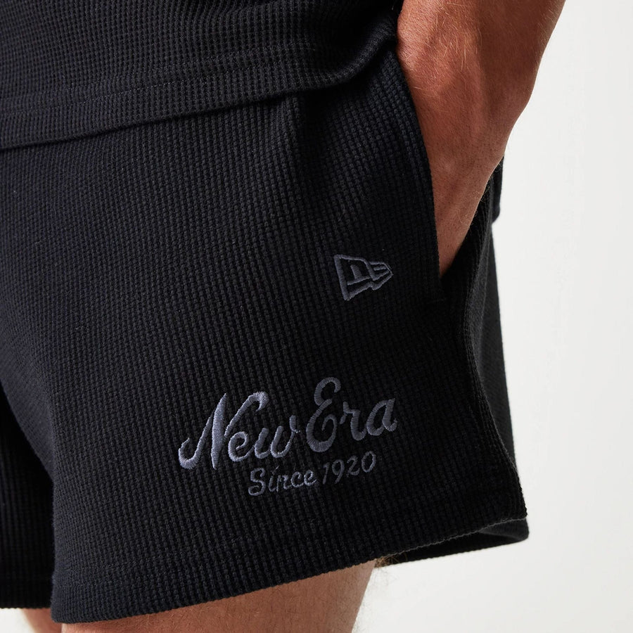The Male model is wearing New Era Waffle Black Shorts 6