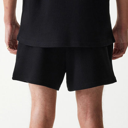 The Male model is wearing New Era Waffle Black Shorts 5