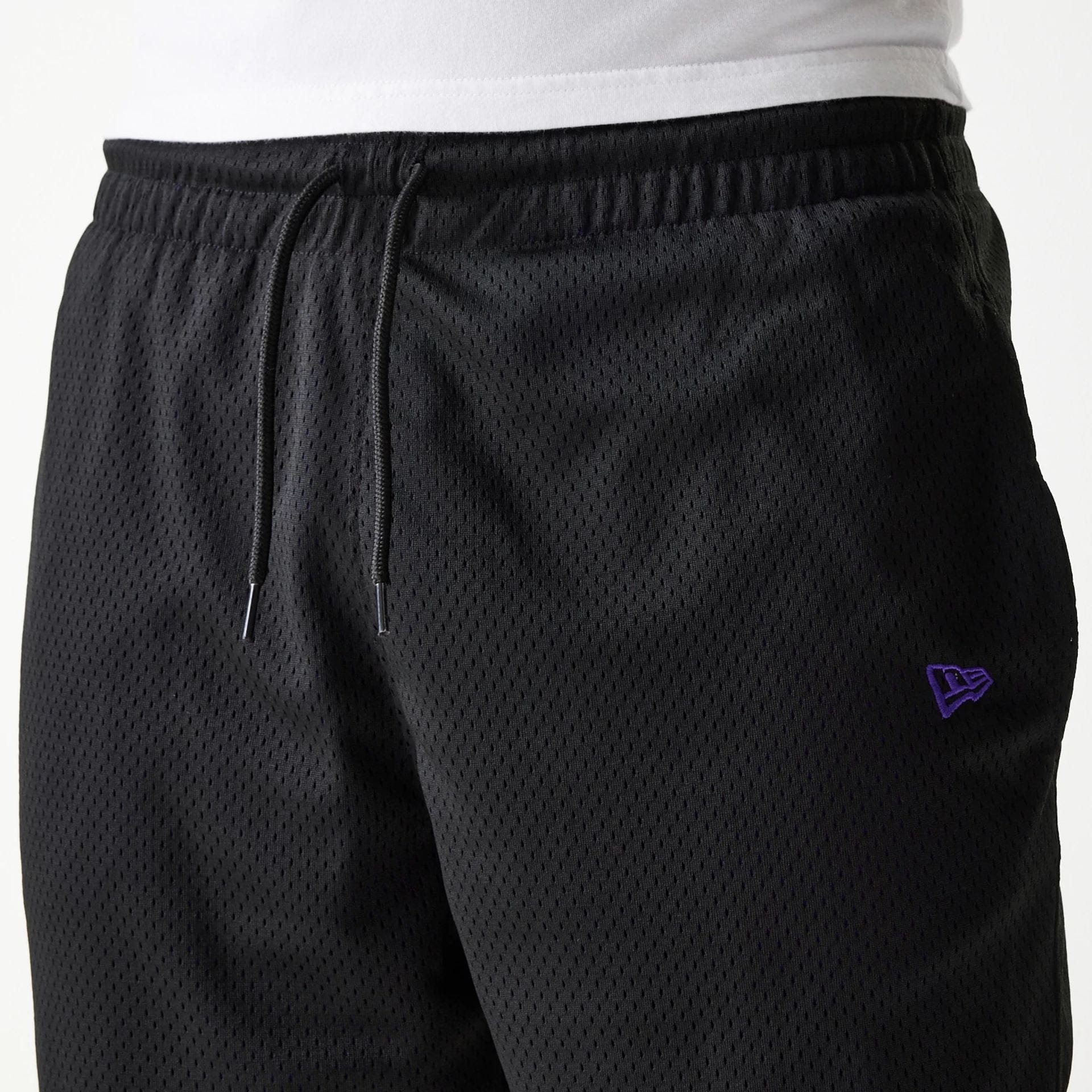 The Male model is wearing New Era Black Mesh Shorts 7