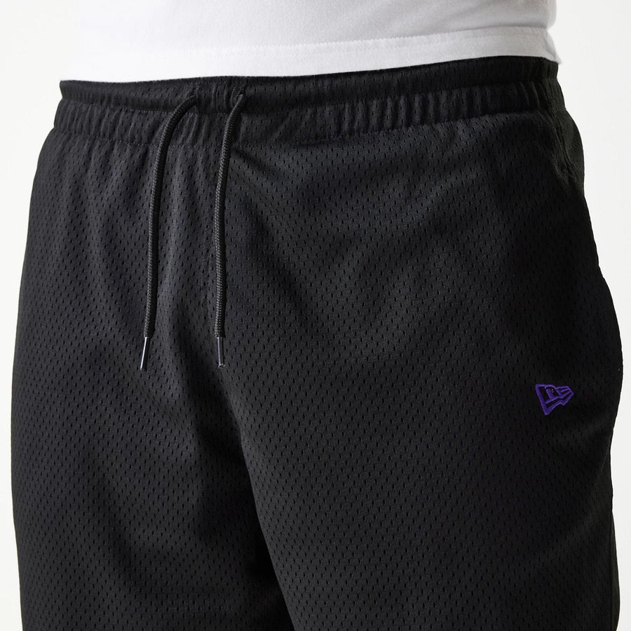 The Male model is wearing New Era Black Mesh Shorts 7