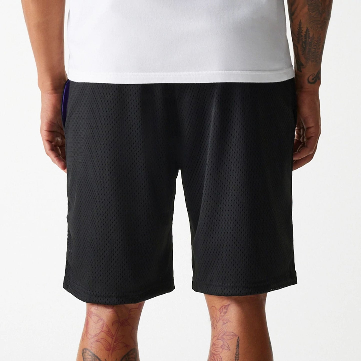 The Male model is wearing New Era Black Mesh Shorts 5