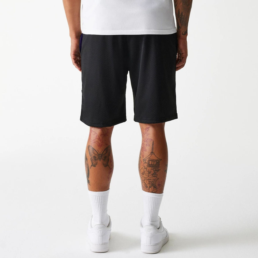 The Male model is wearing New Era Black Mesh Shorts 2