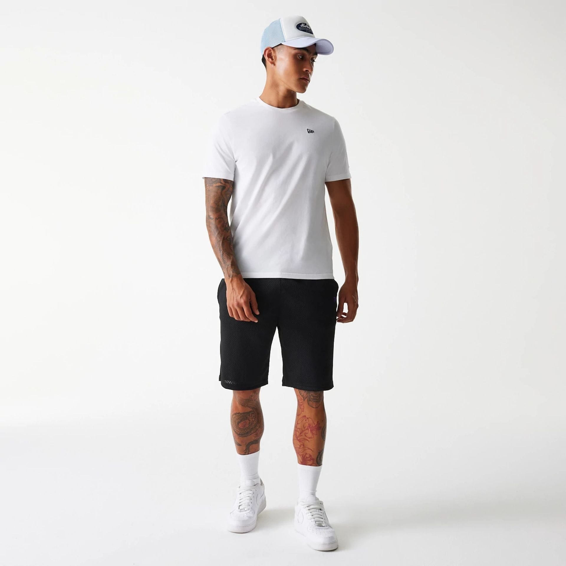 The Male model is wearing New Era Black Mesh Shorts 8