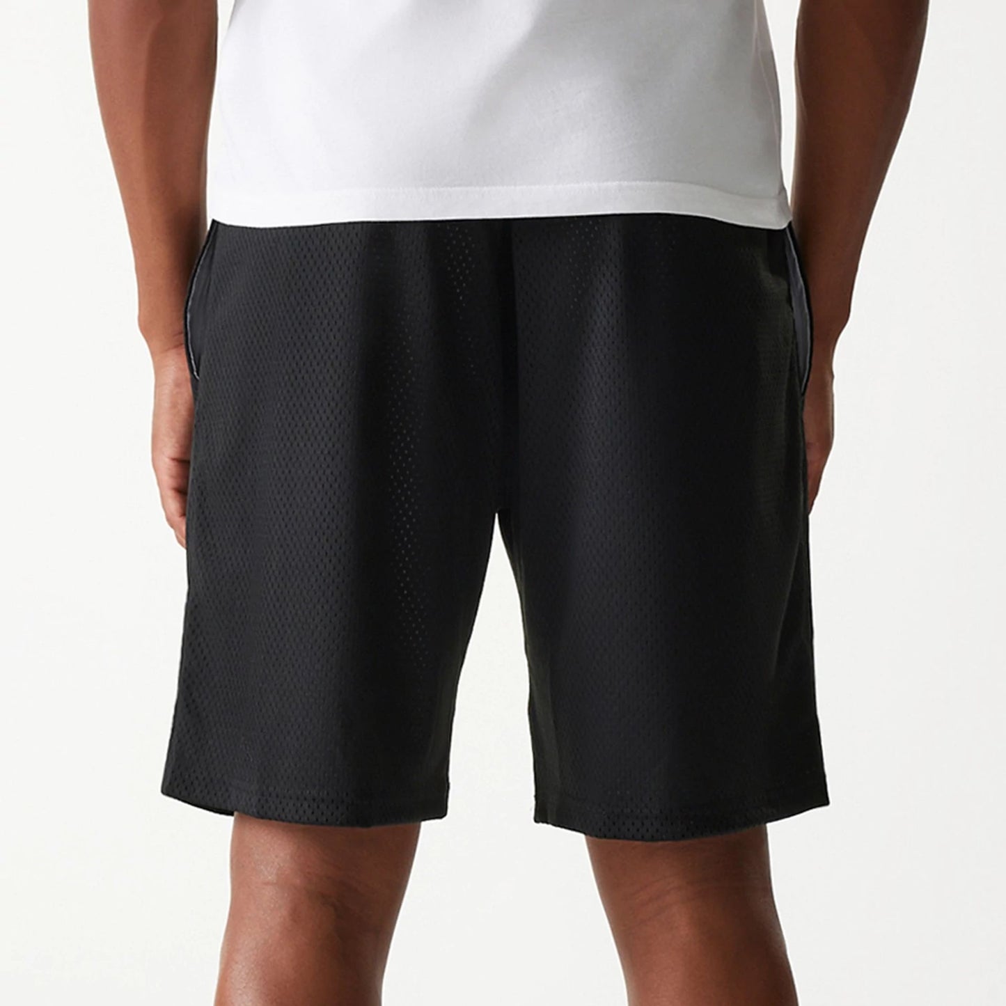 The Male model is wearing New Era Black Mesh Shorts 5