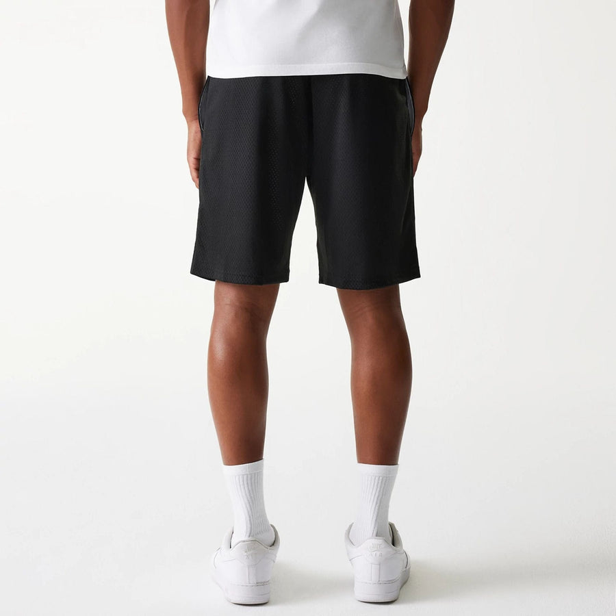 The Male model is wearing New Era Black Mesh Shorts 2