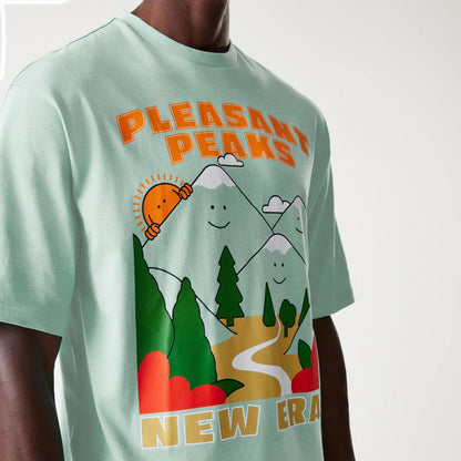 The Male model is wearing New Era Outdoor Graphic Pastel Green Oversized T-Shirt 3