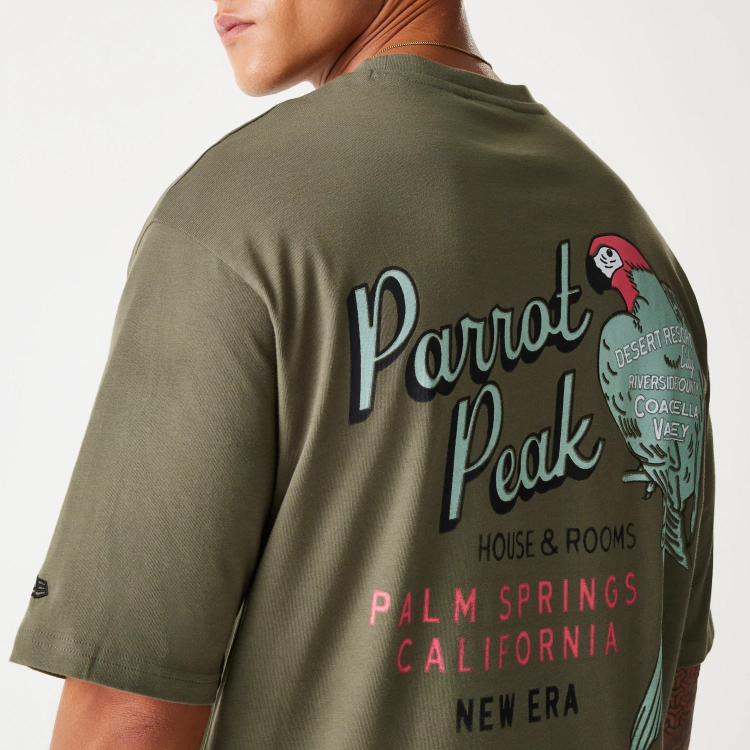 The Male model is wearing New Era Animal Graphic Green Oversized T-Shirt 6