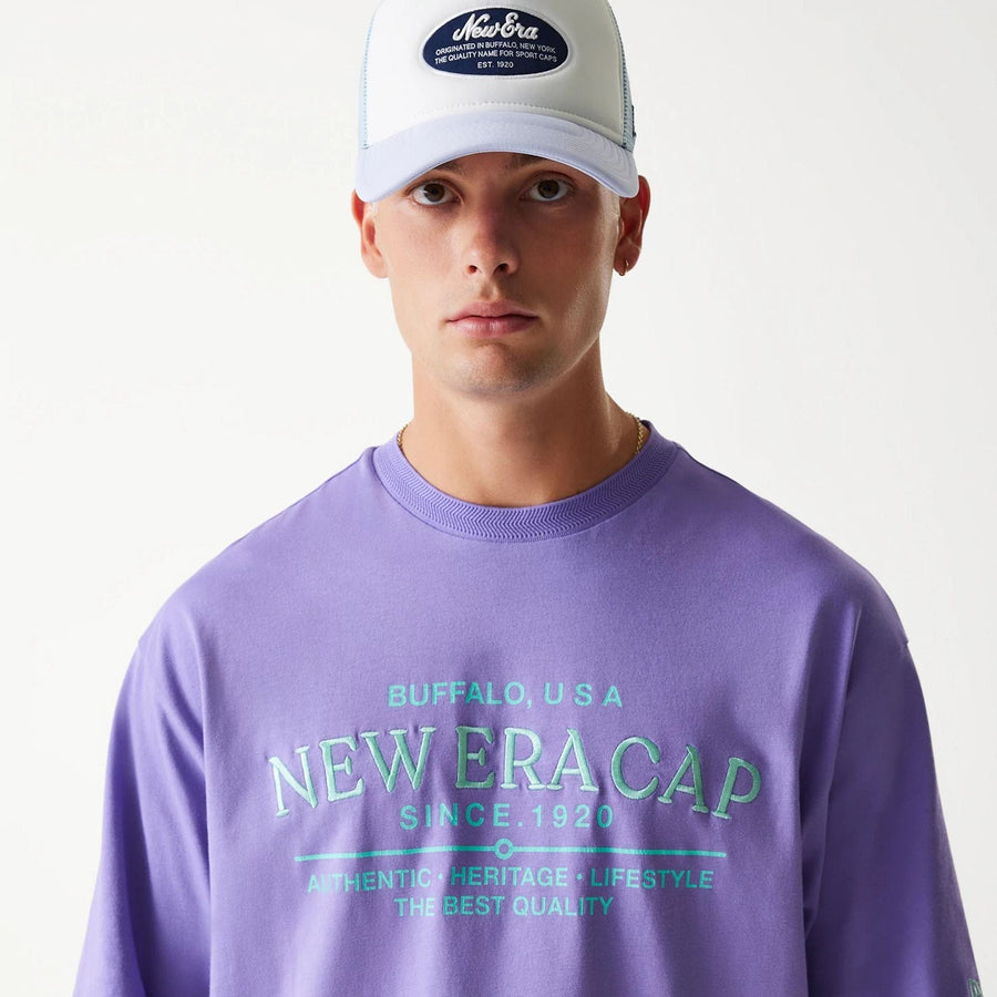 The Male model is wearing New Era Graphic Purple Oversized T-Shirt 7