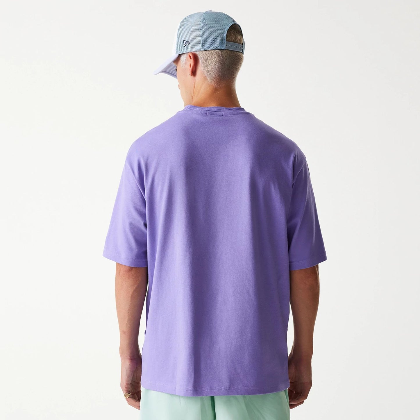 The Male model is wearing New Era Graphic Purple Oversized T-Shirt 2