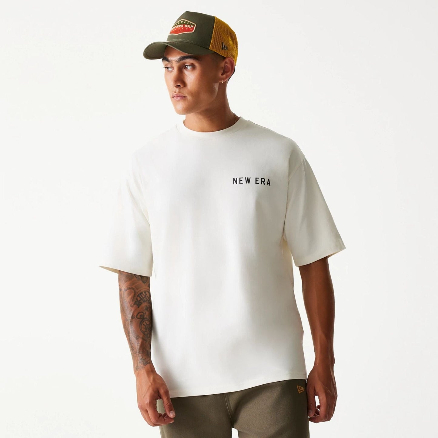 The Male model is wearing New Era Animal Graphic Open White Oversized T-Shirt 1