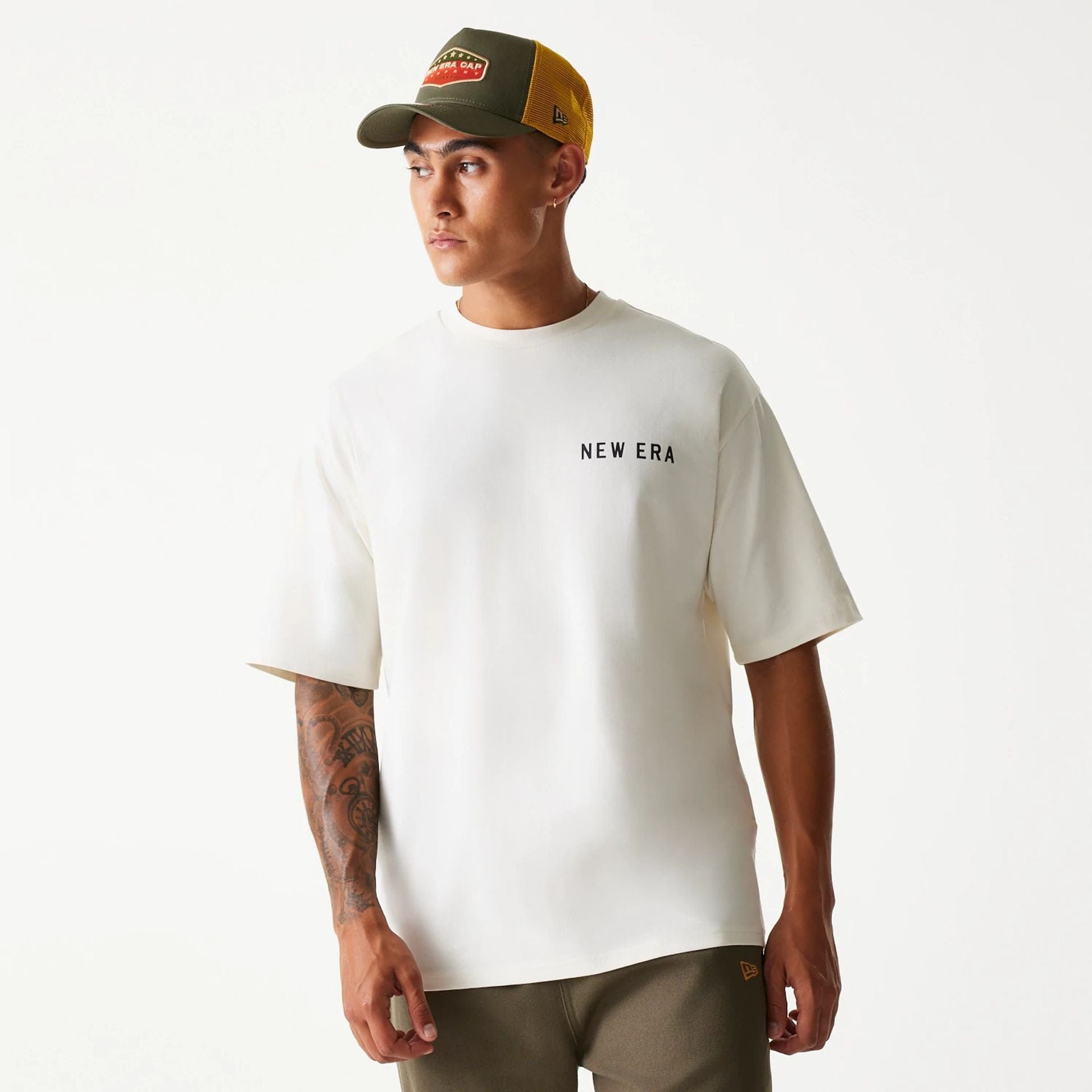 The Male model is wearing New Era Animal Graphic Open White Oversized T-Shirt 1