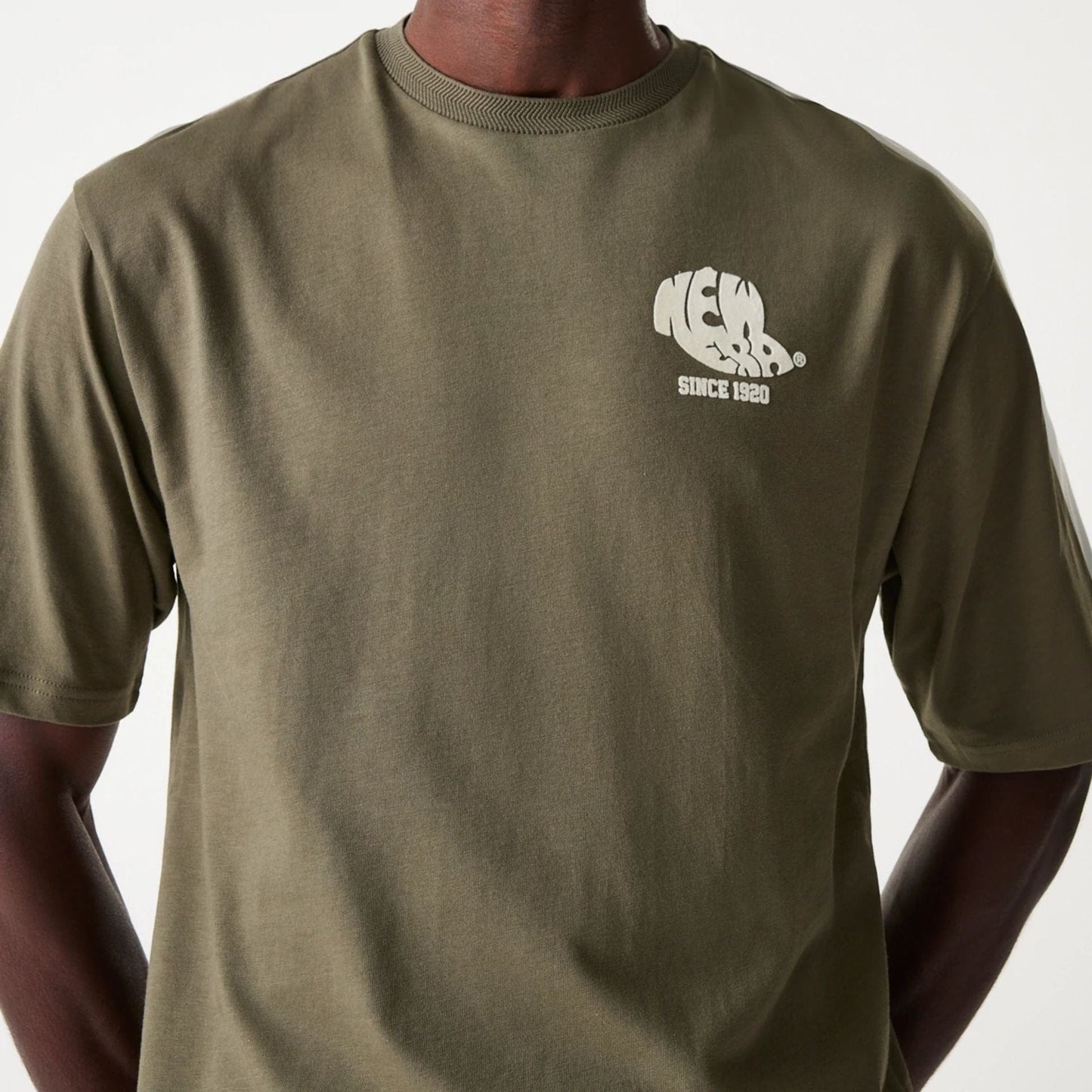 The Male model is wearing New Era Graphic Green Oversized T-Shirt 3