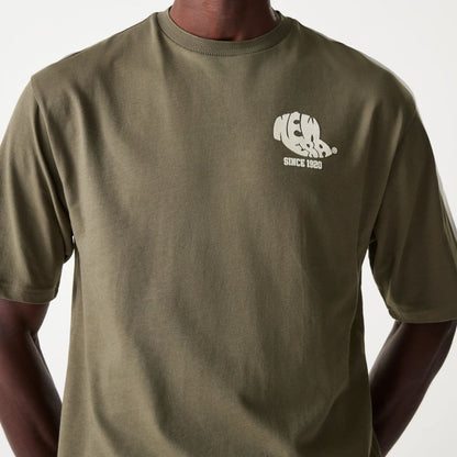 The Male model is wearing New Era Graphic Green Oversized T-Shirt 3